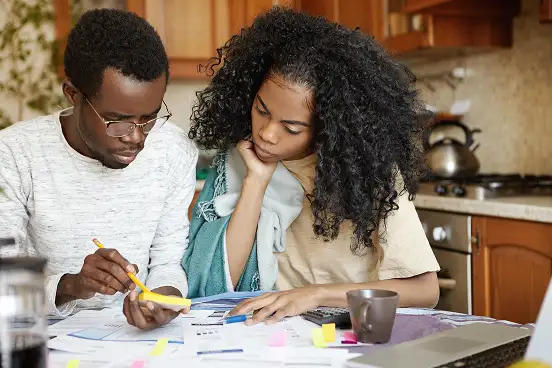 Young African couple discussing wealth creation and investment opportunities